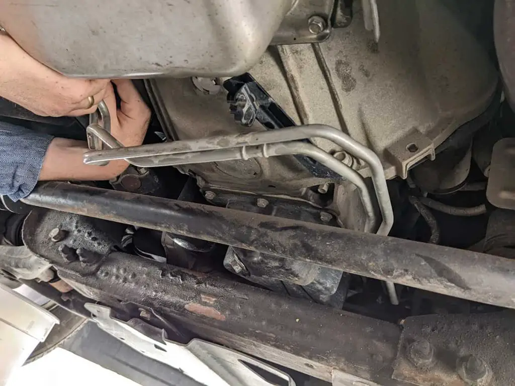 Transmission Line to Radiator Fitting Leaking Symptoms, Causes